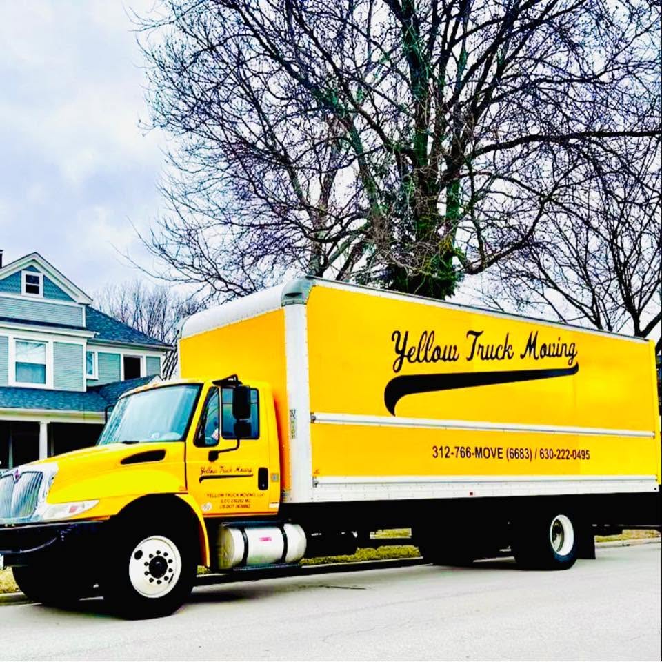 Yellow Truck Moving branded box truck parked on a residential street